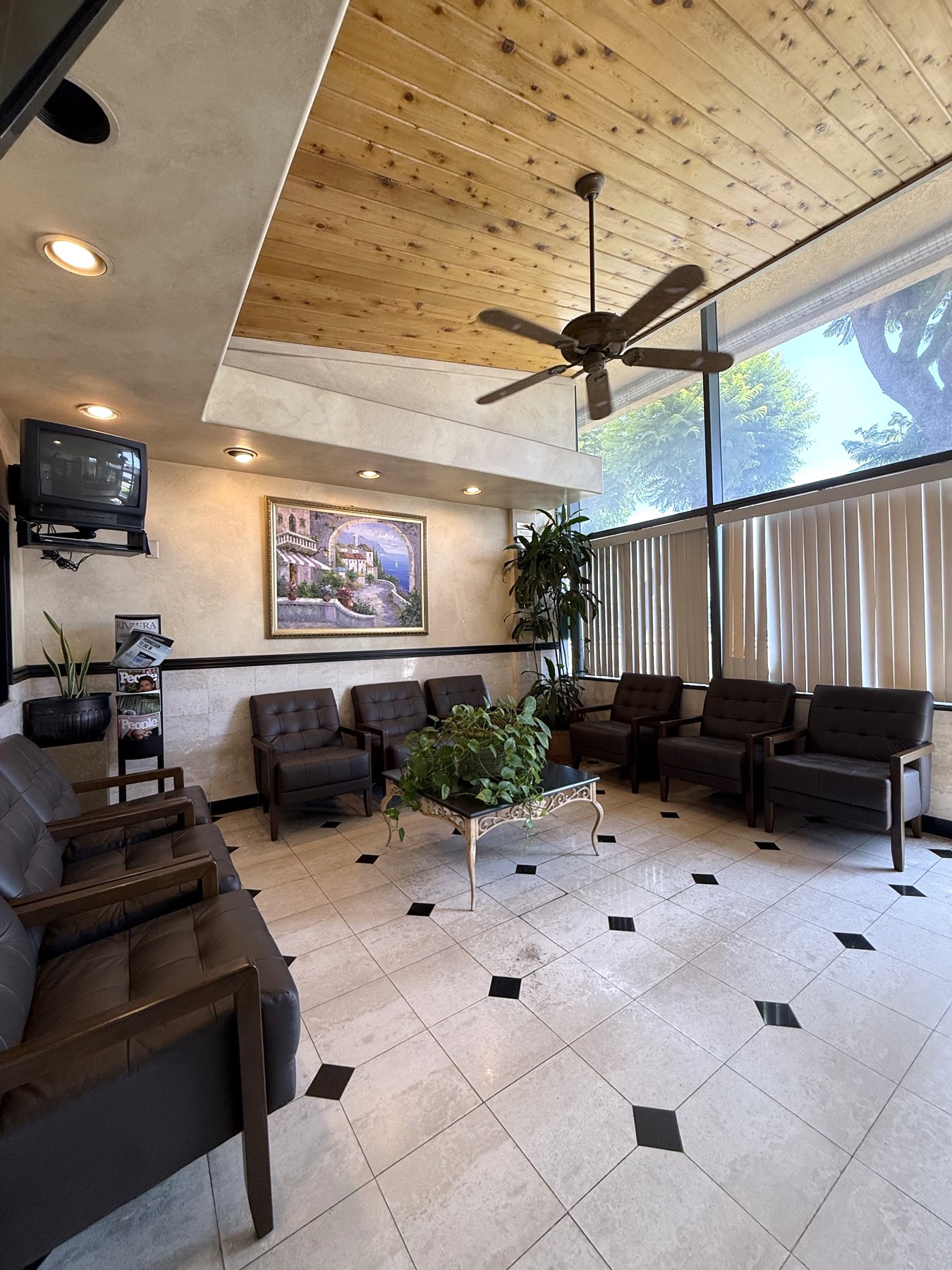 Sunlit waiting room with comfortable seating at Comfort Dental Garden Grove